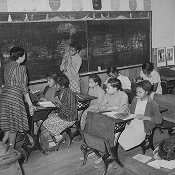 black children learn in an elementary school classroom